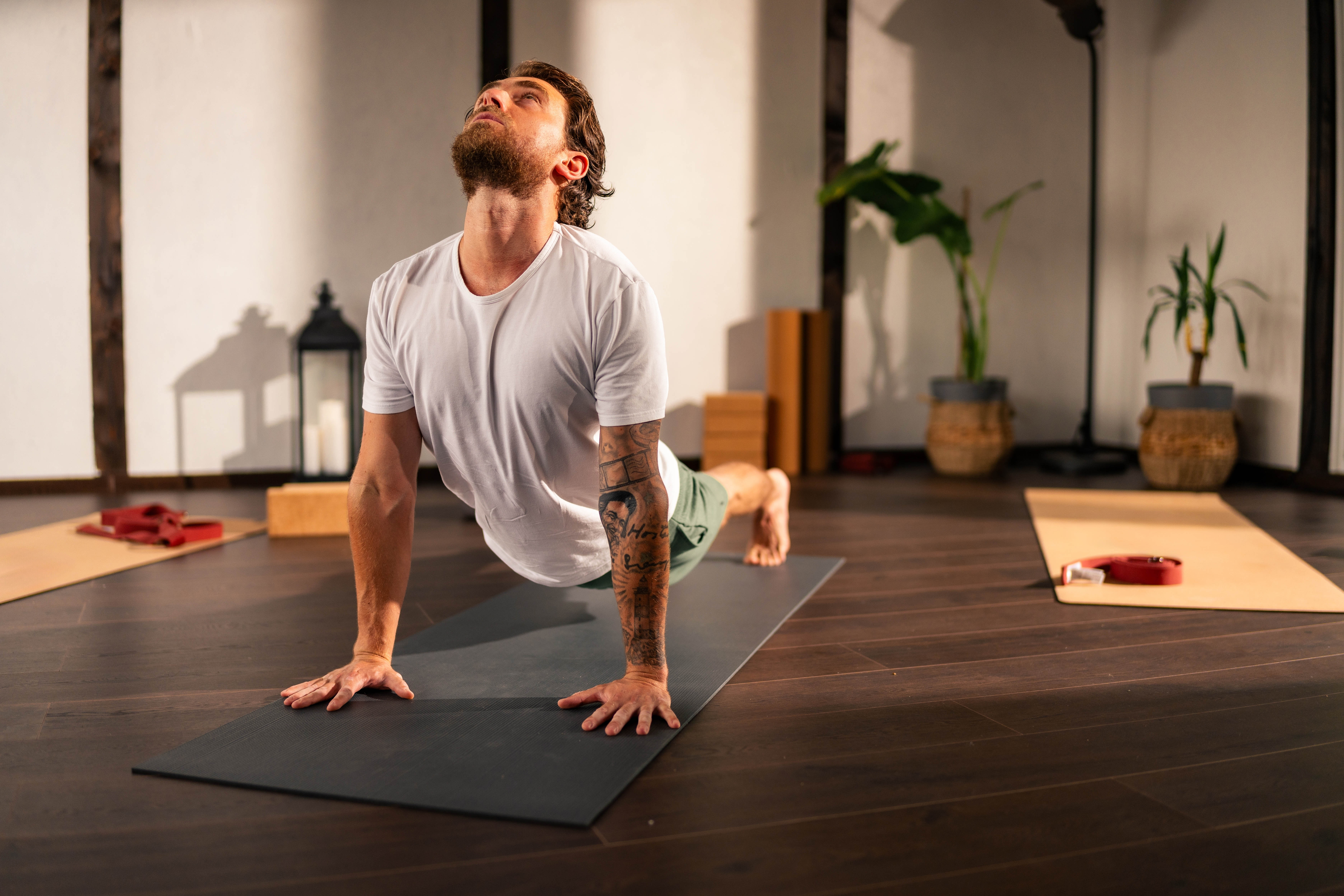 Man doing yoga at the gym Man doing yoga at the gym
